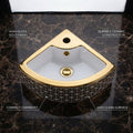 InArt designer small corner wash basin in glossy golden white ceramic, angled view for compact bathrooms