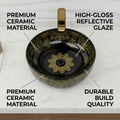 Designer wash basin table top in glossy black ceramic, round modern basin design, angled view