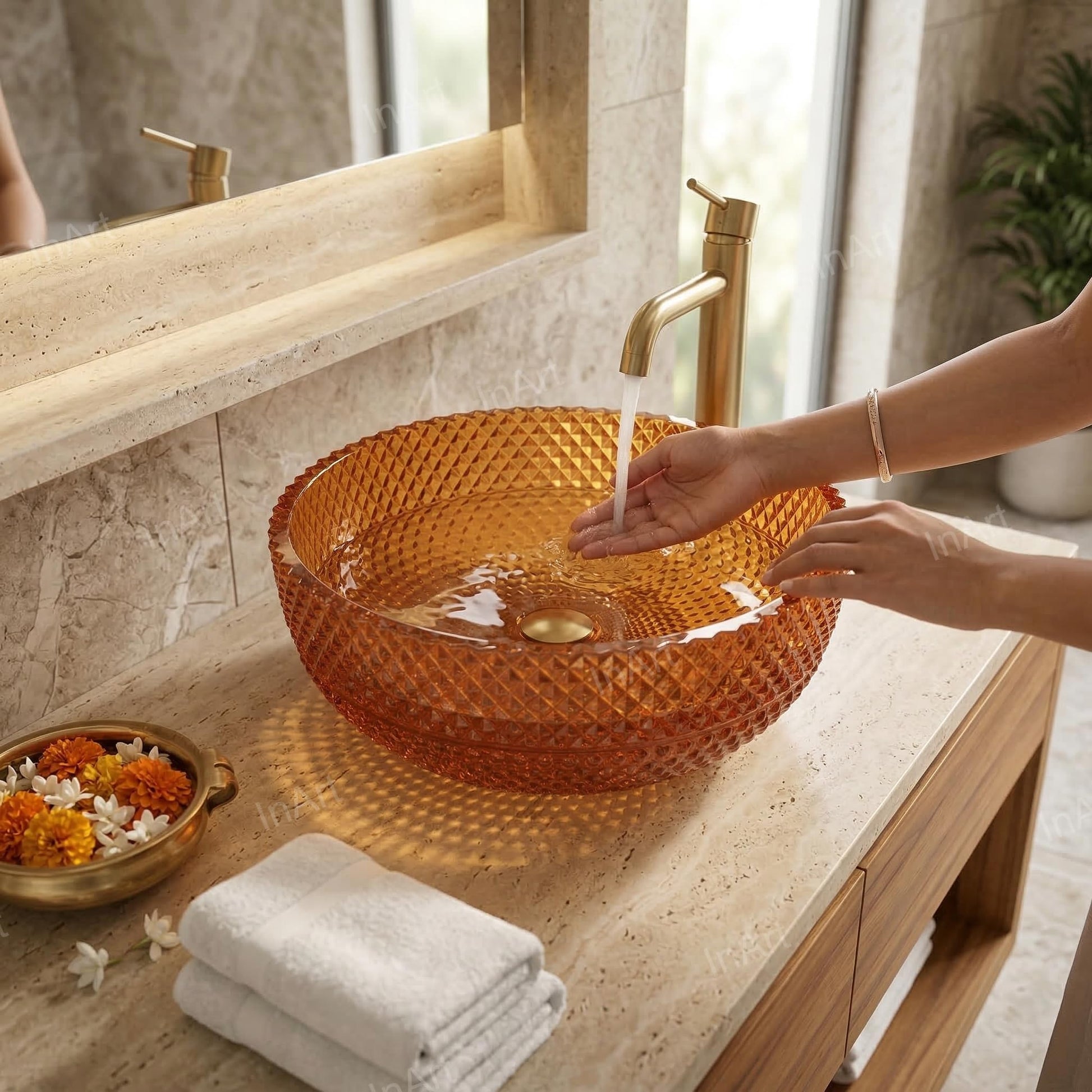 Close-up of amber glass wash basin design with light reflections, smooth round rim detail