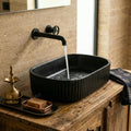 Close-up of matte black ceramic wash basin rim and smooth finish, premium sanitaryware for bathrooms