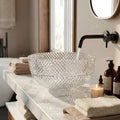 Top view of round clear glass wash basin design for table top installation