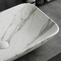 Close-up of glossy white ceramic wash basin design with marble pattern, easy-clean finish