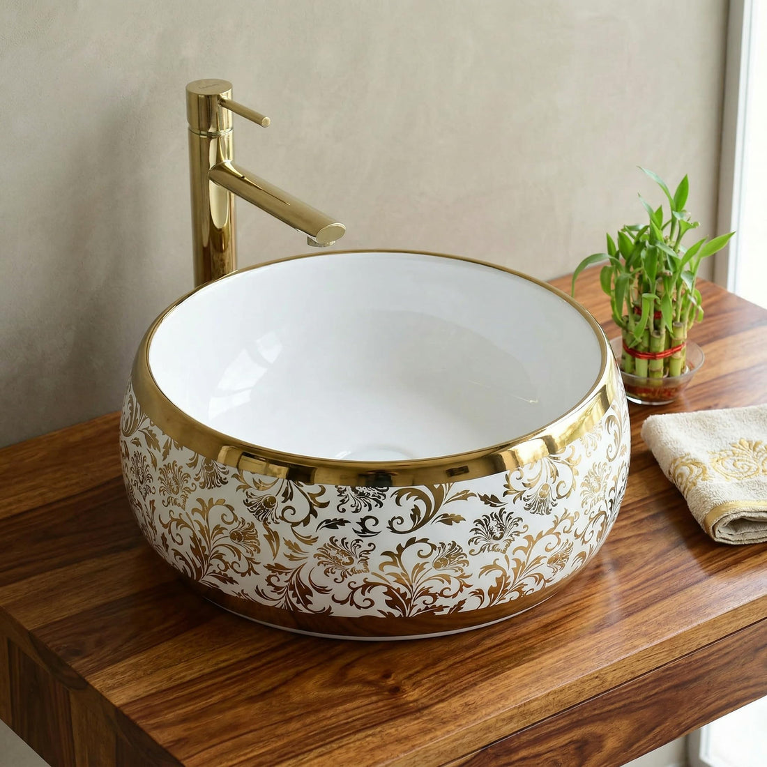 Luxury wash basin by InArt, round ceramic table top design in glossy white with gold rim, front view