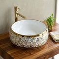 Luxury wash basin by InArt, round ceramic table top design in glossy white with gold rim, front view
