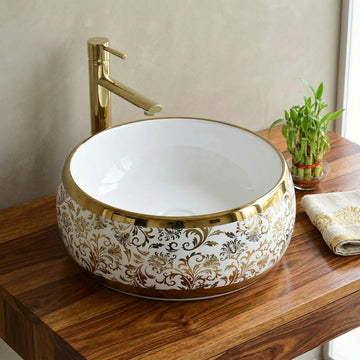 Luxury wash basin by InArt, round ceramic table top design in glossy white with gold rim, front view