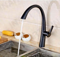InArt kitchen tap with pull out spray head, single lever brass sink mixer in black matt finish close-up
