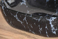 Close-up of glossy black marble colour ceramic table top wash basin rim and smooth finish detail