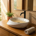 InArt premium sanitaryware countertop wash basin, glossy marble finish oval basin close-up of smooth rim