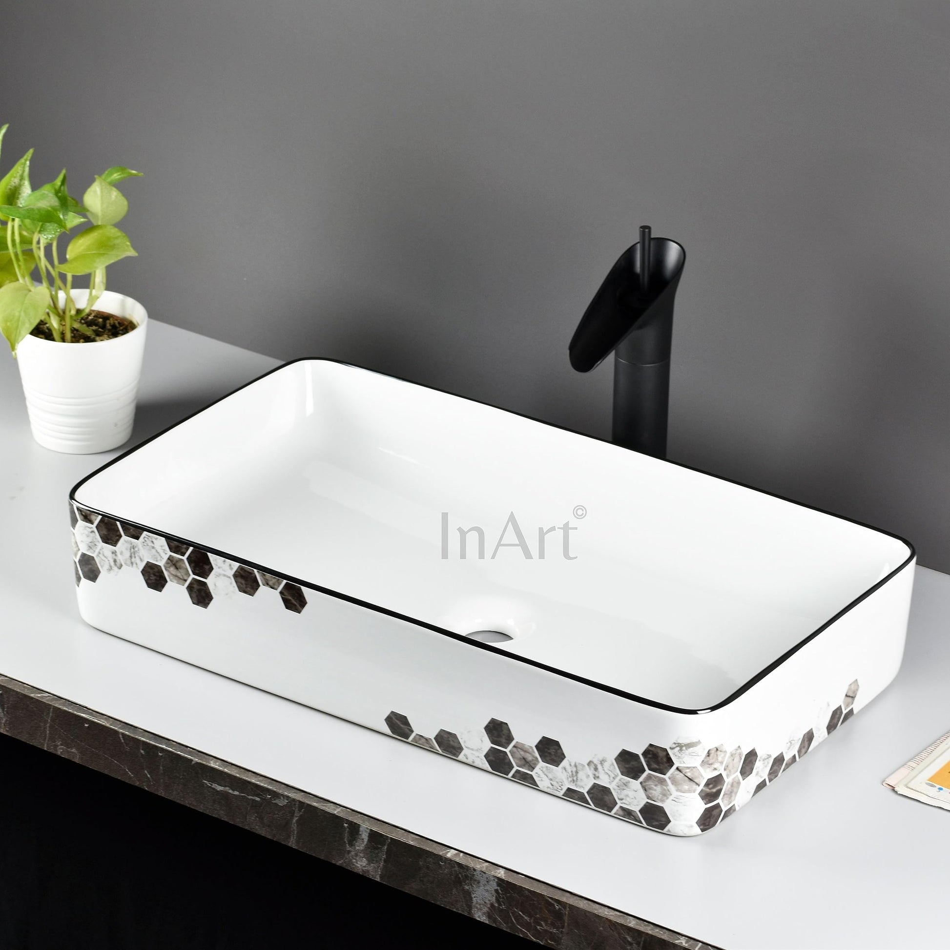 InArt wash basin countertop in modern bathroom interior, premium ceramic rectangular basin, black white
