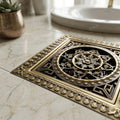 Close-up of brass drain jali grid in antique bronze finish, durable square bathroom floor drain
