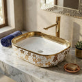 InArt tabletop washbasin close-up of gold rim on glossy white ceramic, premium sanitaryware detail
