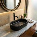 InArt table top wash basin design 51x31 cm, matte black marble texture close-up detail