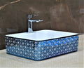 Modern table top wash basin for vanity cabinet, glossy blue ceramic rectangular basin, 3/4 view