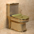 Close-up of soft close toilet seat on gold one piece commode, smooth ceramic finish and oval bowl