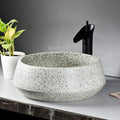 Premium ceramic wash basin table top, InArt round light green basin with drain hole detail, close-up