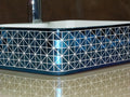 Blue ceramic counter top wash basin with glossy finish, smooth rim and deep bowl detail