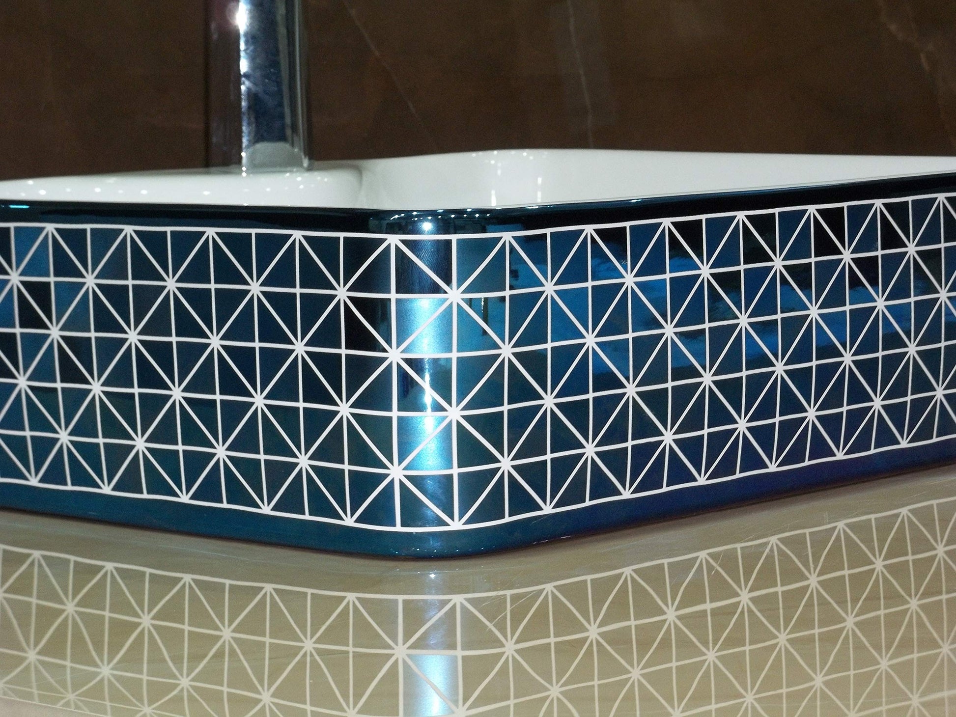 Blue ceramic counter top wash basin with glossy finish, smooth rim and deep bowl detail