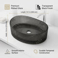 Over counter wash basin placement example with oval black glass basin