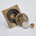 Top view of brass bathroom drain grating showing square pattern and finish