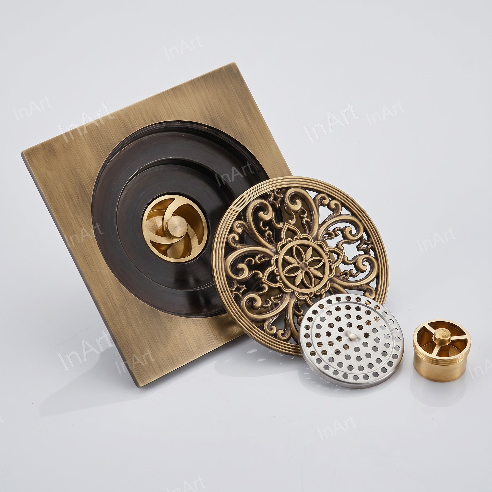 Top view of brass bathroom drain grating showing square pattern and finish