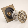 Detail shot of drain opening and grating edges in antique brass finish