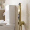 Water saving jet spray for washroom use with brushed gold look