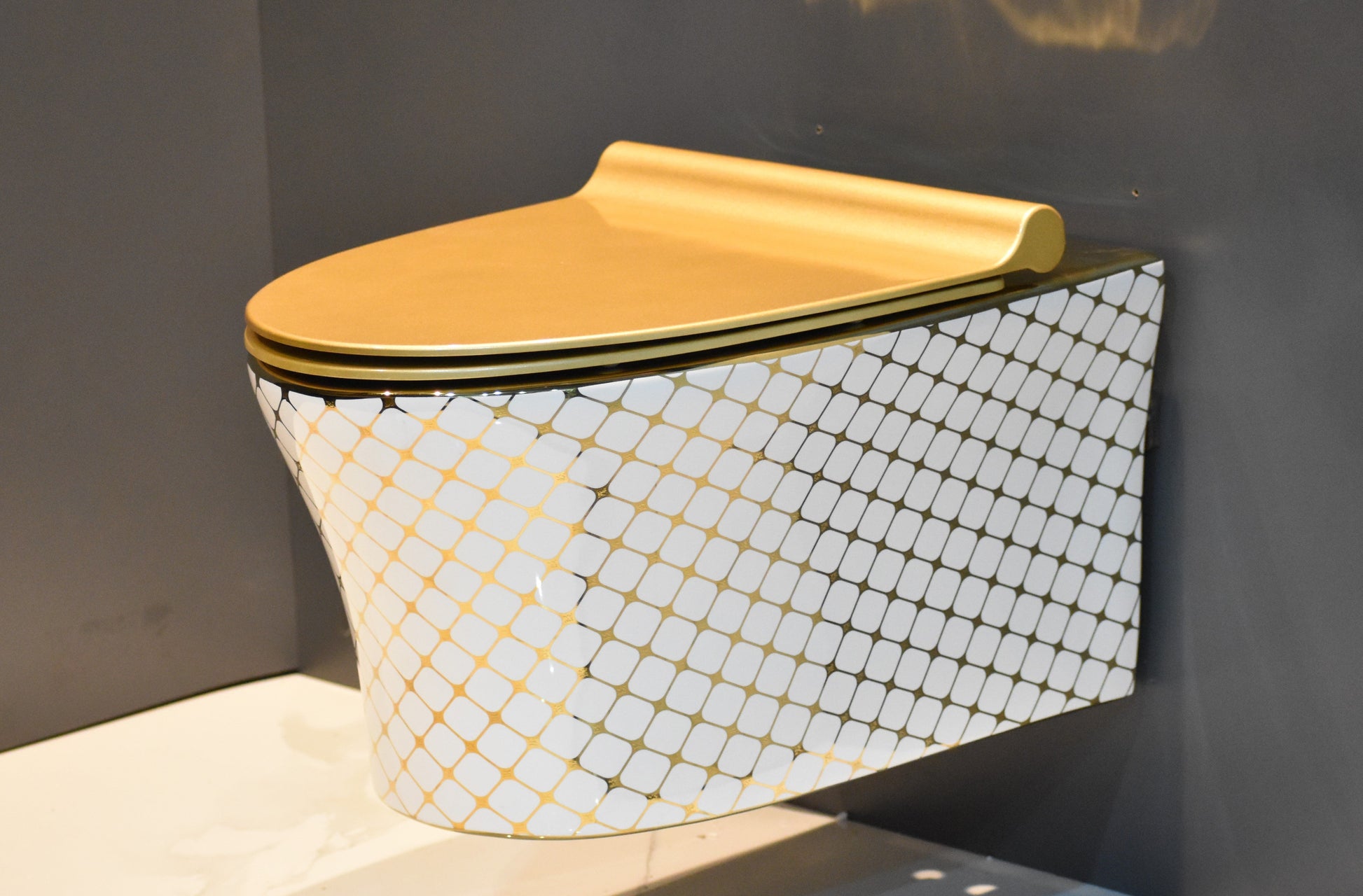 InArt ceramic gold wall hung toilet seat - detailed mounting bracket and installation hardware close-up view